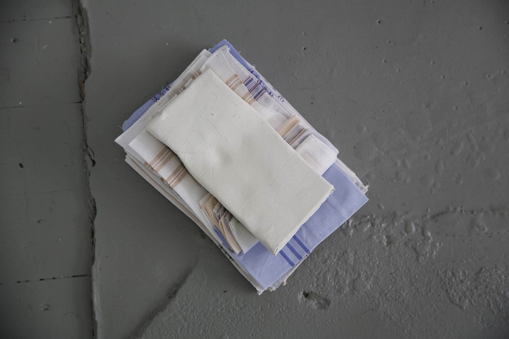Sleep Prop (Right Hand), handkerchiefs, ceramic clay, 22 x 16 x 6 cm, 2013
